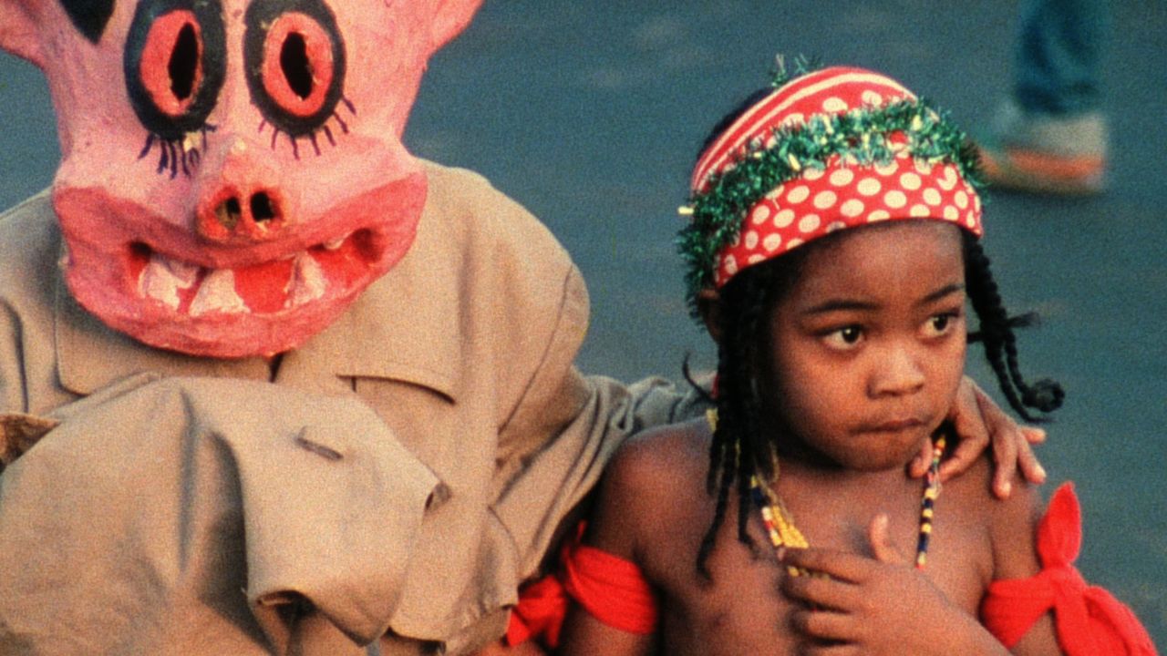 person in a pink costume next to a child